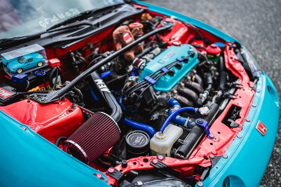Detailed view of customized Honda engine in vibrant colors. - benefits of cold air intake systems