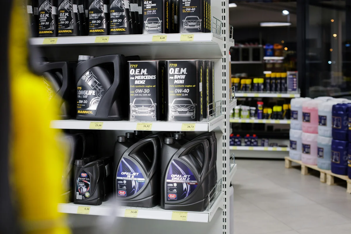 Automotive shop interior. Motor oil product shelf. Good for illustration in automotive editorials and blogs. - best synthetic oil for high mileage engines