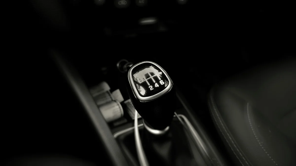 a black and white photo of a steering wheel - future of manual transmission cars