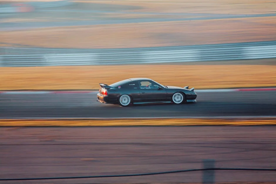 Nissan 240SX speeding on a race track, showcasing motion blur and high performance. - street legal track day cars