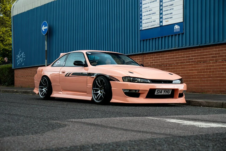 A peach-colored Nissan Silvia S14 parked on a street in Southampton, UK. - underrated jdm cars under 10k