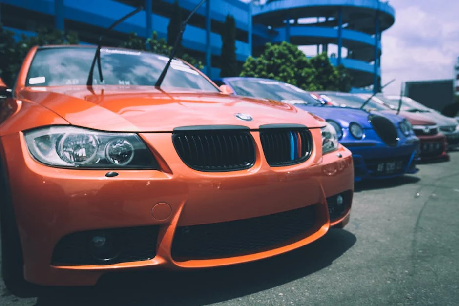 Vibrant BMW cars parked outdoors showcasing an array of colors and designs. - is it worth buying a high mileage bmw